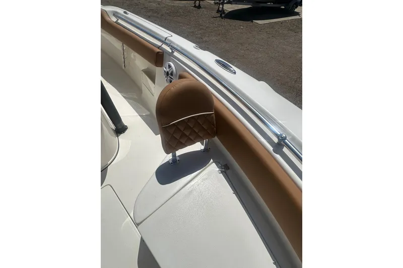 Slide: The Image of 2026 Key West 239 FS boat interior with tan seating and stainless steel railings. - 22