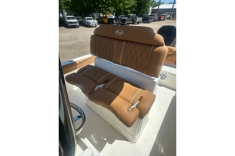 Slide: The Image of 2026 Key West 239 FS boat with luxurious tan seating and sleek design. - 23