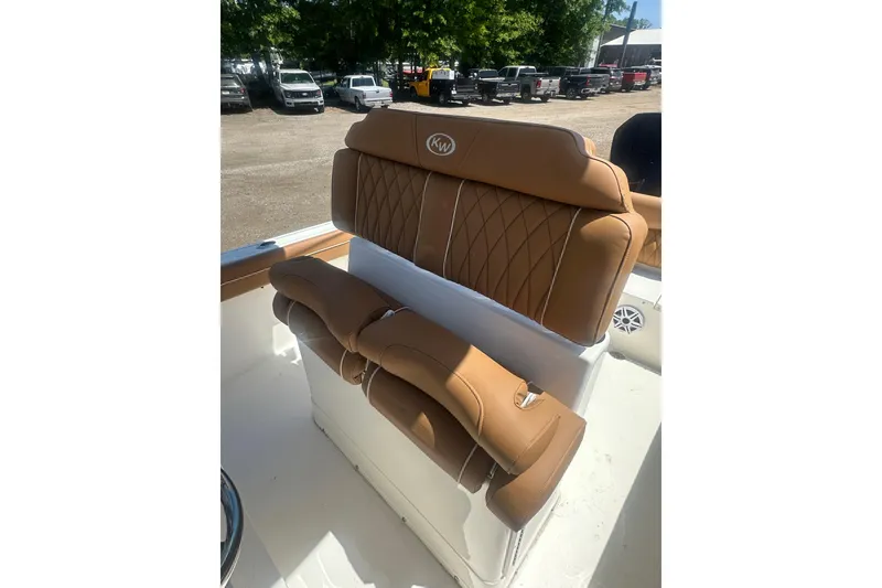 Slide: The Image of Luxurious tan seating on 2026 Key West 239 FS boat, featuring diamond stitching. - 24