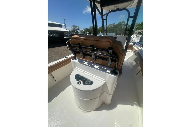 Slide: The Image of 2026 Key West 239 FS boat interior with seating and rod holders. - 26