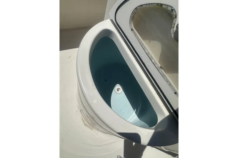 Slide: The Image of Livewell on 2026 Key West 239 FS boat, featuring a clean, oval design. - 27