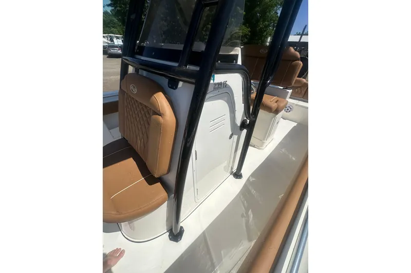 Slide: The Image of 2026 Key West 239 FS boat interior with tan seating and sleek design. - 30
