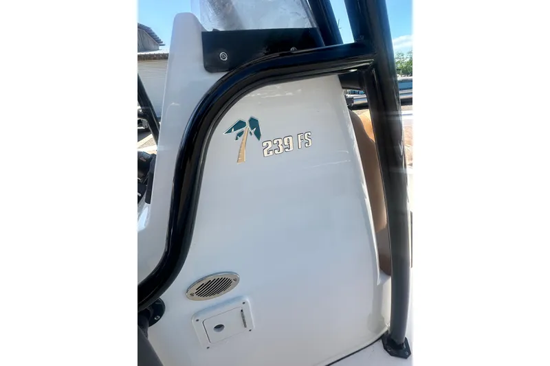 Slide: The Image of 2026 Key West 239 FS boat console with logo and palm tree design. - 32