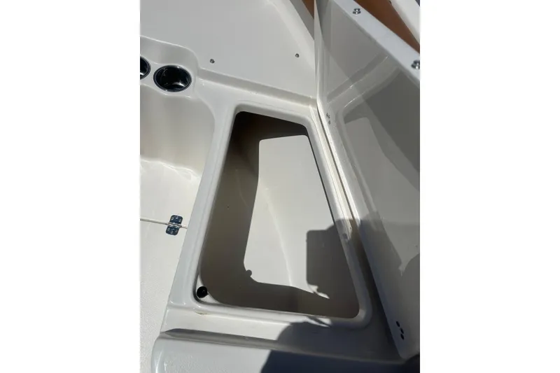 Slide: The Image of Storage compartment on 2026 Key West 239 FS boat, open lid, white interior. - 34