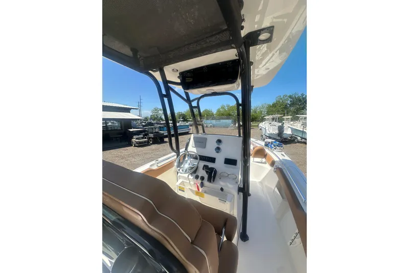 Slide: The Image of 2026 Key West 239 FS boat interior with steering console and seating. - 43