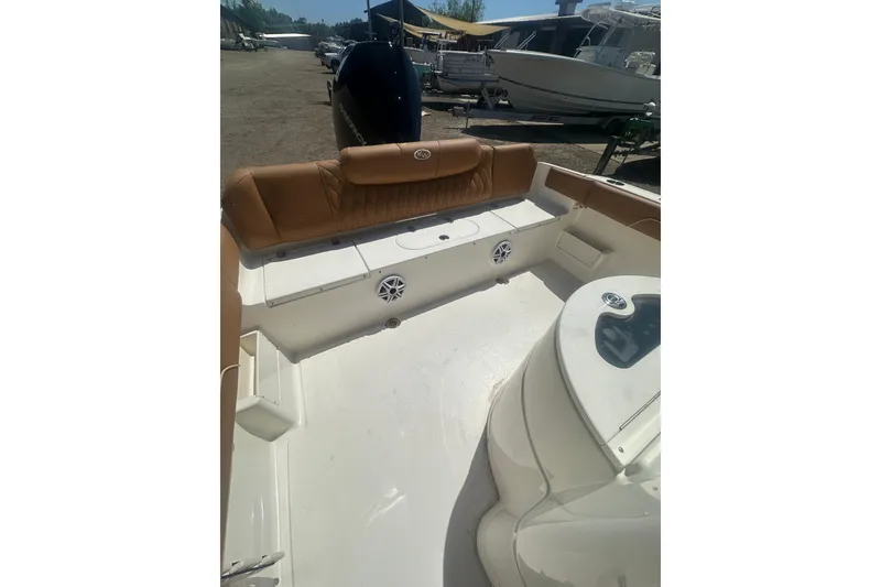 Slide: The Image of 2026 Key West 239 FS boat interior with tan seating and modern features. - 50