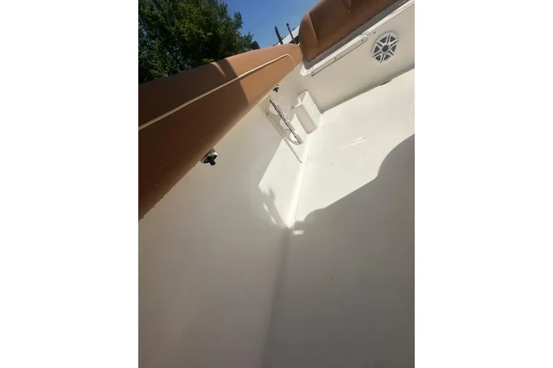 Slide: The Image of Interior view of 2026 Key West 239 FS boat, featuring tan seating and white deck. - 52