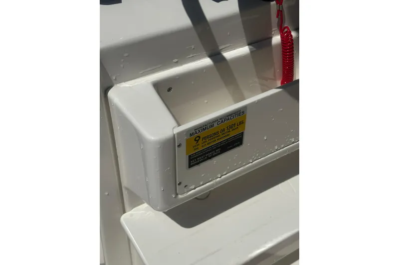 Slide: The Image of Close-up of 2026 Key West 239 FS boat capacity label with water droplets. - 55