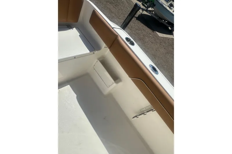 Slide: The Image of Interior view of 2026 Key West 239 FS boat with tan seating and white deck. - 56