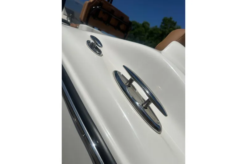 Slide: The Image of Close-up of 2026 Key West 239 FS boat cleat and railing under clear blue sky. - 57