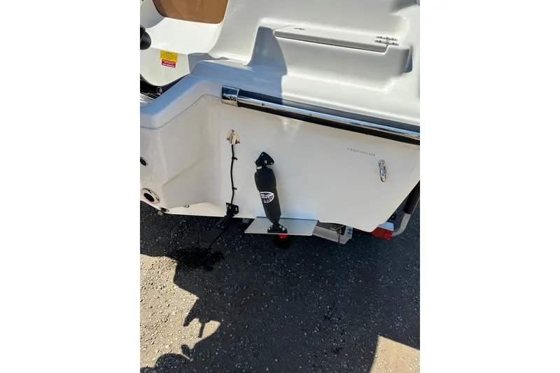 Slide: The Image of 2026 Key West 239 FS boat stern view with trim tabs and ladder. - 58