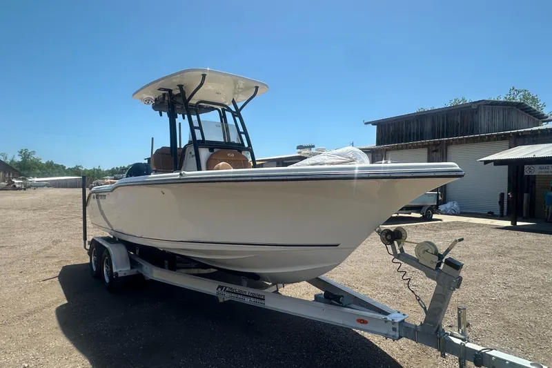 Slide: The Image of 2026 Key West 239 FS boat on trailer in outdoor setting. - 9