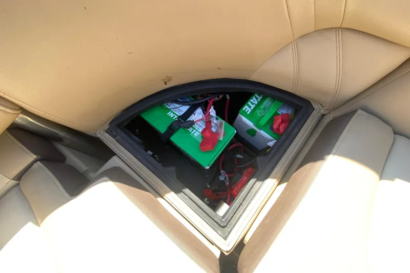 Slide: The Image of Battery compartment of 2018 Harris Solstice 240 with wiring and switch. - 14