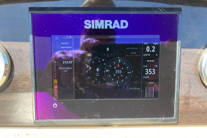 Slide: The Image of Dashboard of 2018 Harris Solstice 240 showing fuel gauge at 21 gallons. - 18