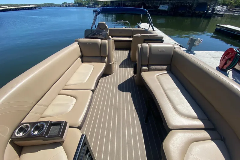 Slide: The Image of Storage compartment of a 2018 Harris Solstice 240 boat with manual and wiring visible. - 26