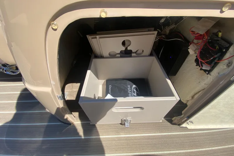 Slide: The Image of 2018 Harris Solstice 240 pontoon boat docked, featuring a Mercury 250 Pro outboard motor. - 27