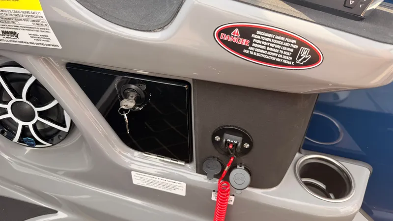 Slide: The Image of Close-up of a Harris Sunliner 230 console with key switch and warning labels. - 39