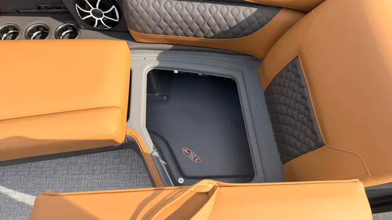 Slide: The Image of Interior of the Harris Sunliner 230 with storage compartment and cushioned seating. - 15