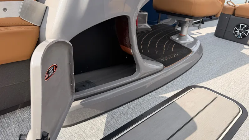 Slide: The Image of The image shows the interior of a 2027 Harris Sunliner 230 with modern seating and flooring. - 22