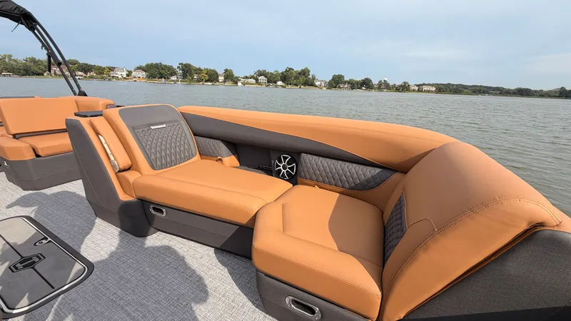 Slide: The Image of The image shows the luxurious interior of a 2027 Harris Sunliner 230 with comfortable seating. - 13
