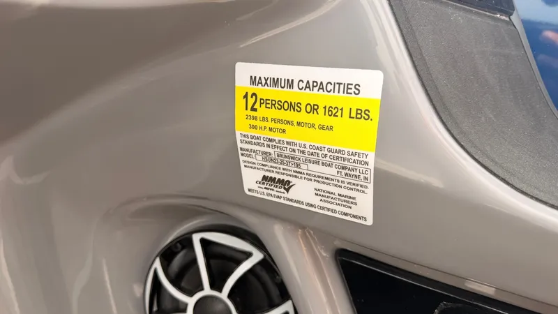 Slide: The Image of A capacity label indicates a maximum of 12 persons or 1621 pounds on board. - 38
