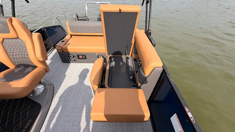 Slide: The Image of The image shows the interior of a 2027 Harris Sunliner 230 with beige seating. - 41
