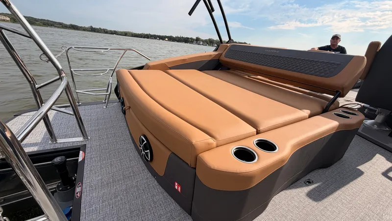 Slide: The Image of The image shows the deck of a 2027 Harris Sunliner 230 with beige upholstery. - 49