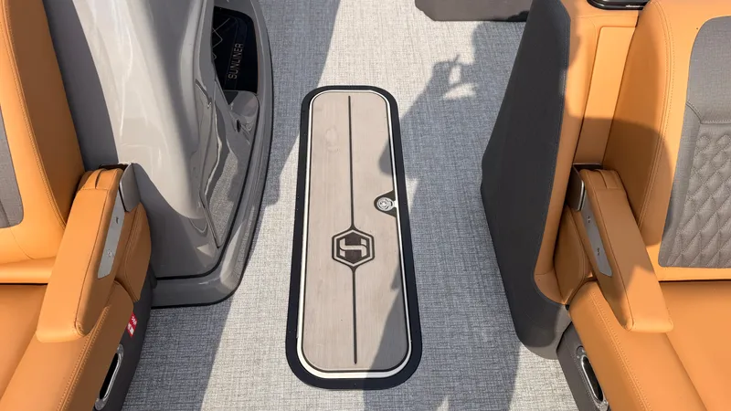 Slide: The Image of The image shows the floor of a Harris Sunliner 230 boat with sleek design and comfortable seating. - 23