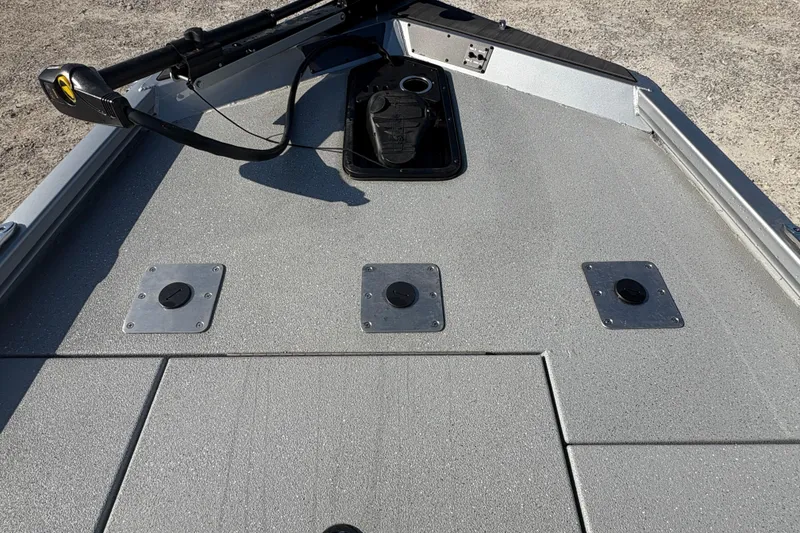 Slide: The Image of Bow deck of 2026 Vexus AVX181 boat with storage compartments and trolling motor. - 11