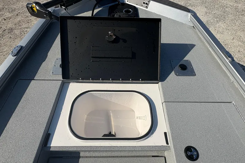 Slide: The Image of 2026 Vexus AVX181 boat livewell compartment with open lid, showcasing interior details. - 13
