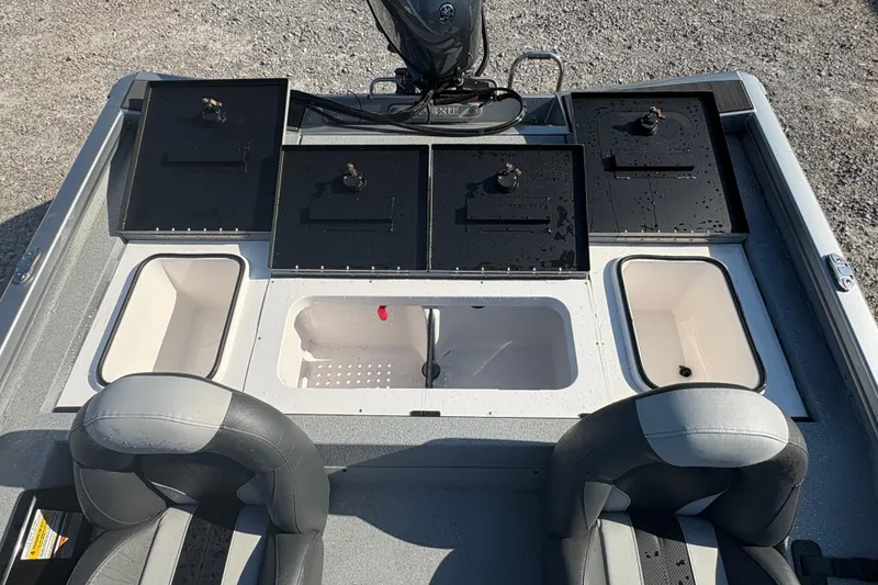 Slide: The Image of 2026 Vexus AVX181 boat interior with storage compartments and seating. - 14