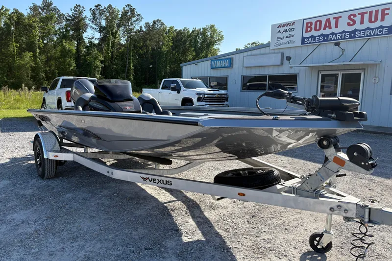 Slide: The Image of 2026 Vexus AVX181 boat on trailer outside dealership, sunny day. - 3