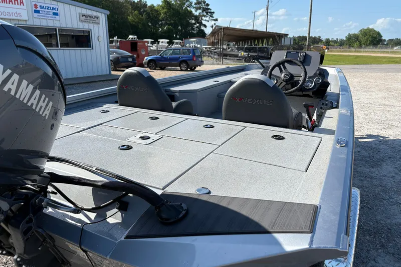 Slide: The Image of 2026 Vexus AVX181 boat with Yamaha engine, parked near dealership, showcasing sleek design. - 6