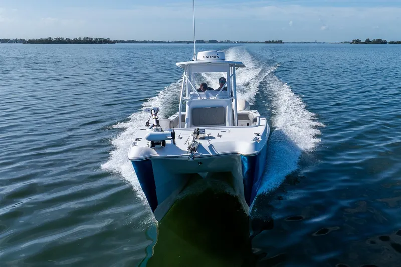 Slide: The Image of 1998 World Cat 266 SF cruising on open water, showcasing sleek design and performance. - 18