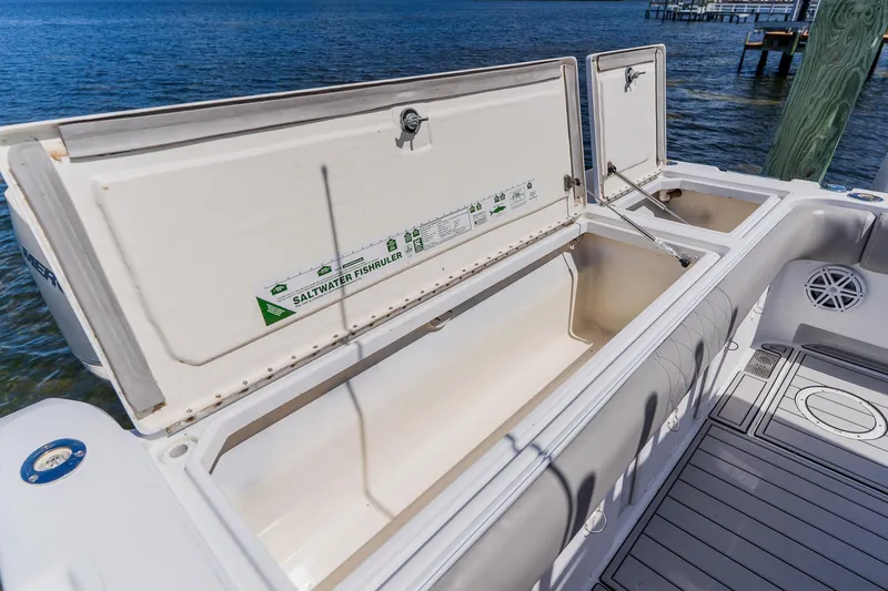 Slide: The Image of Open storage compartment on a 1998 World Cat 266 SF boat, with ocean view. - 38