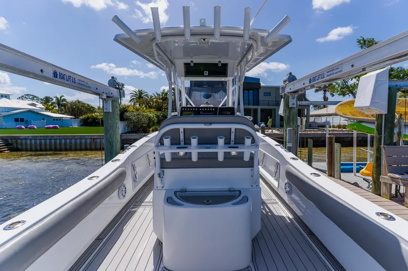 Slide: The Image of 1998 World Cat 266 SF boat docked, featuring a spacious deck and modern amenities. - 41