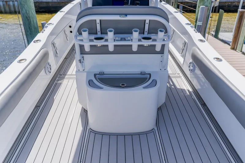 Slide: The Image of 1998 World Cat 266 SF boat interior with rod holders and storage compartments. - 42