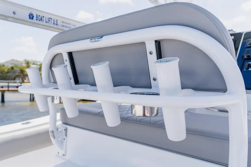 Slide: The Image of Rod holders on a 1998 World Cat 266 SF boat, featuring sleek white design. - 47