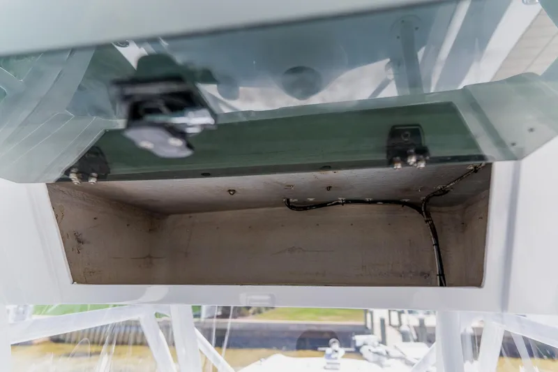 Slide: The Image of Storage compartment of a 1998 World Cat 266 SF boat, showing interior wiring. - 49