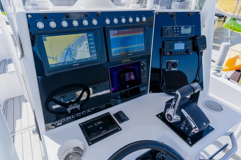 Slide: The Image of Control panel of a 1998 World Cat 266 SF boat with navigation equipment. - 57