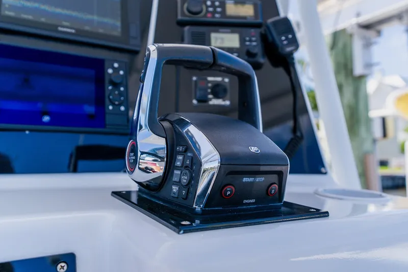 Slide: The Image of Control panel of a 1998 World Cat 266 SF boat with modern navigation equipment. - 63