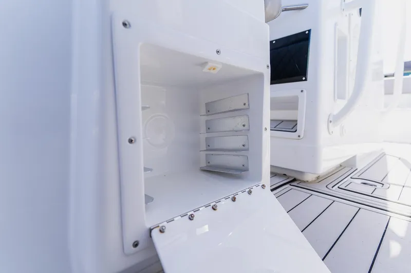 Slide: The Image of Open storage compartment on a 1998 World Cat 266 SF boat, showcasing interior details. - 66