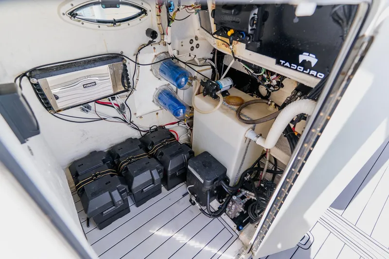 Slide: The Image of Interior view of a 1998 World Cat 266 SF boat's electrical and mechanical components. - 68