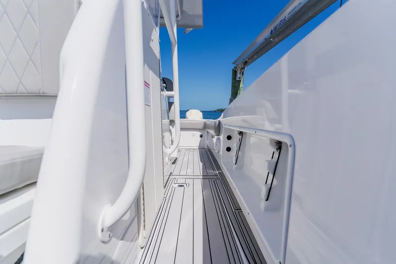 Slide: The Image of 1998 World Cat 266 SF boat interior with white seating and sleek design. - 72