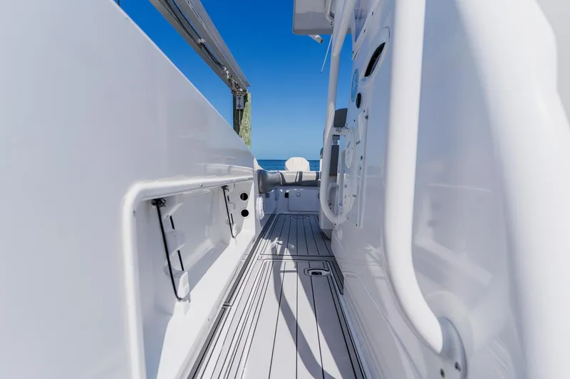 Slide: The Image of 1998 World Cat 266 SF boat deck with sleek white finish and ocean view. - 73