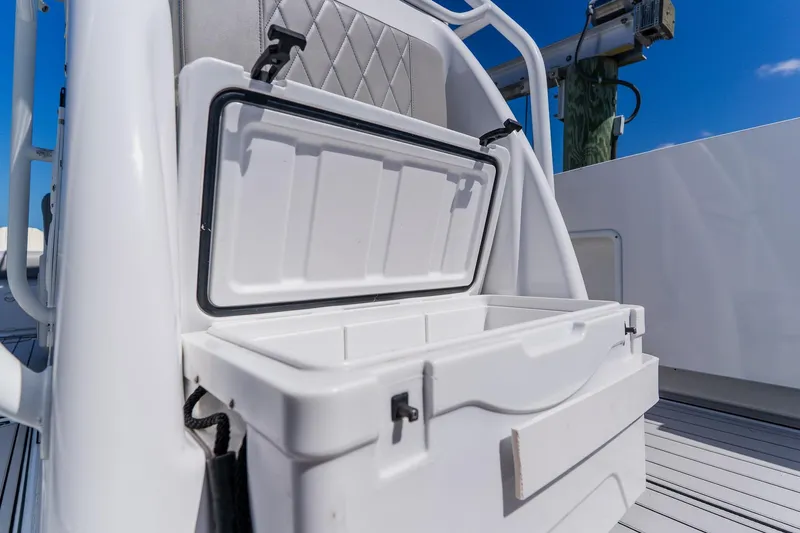 Slide: The Image of Open storage compartment on a 1998 World Cat 266 SF boat, featuring a sleek white design. - 80