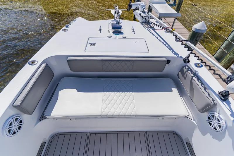 Slide: The Image of 1998 World Cat 266 SF boat interior with cushioned seating and deck view. - 82