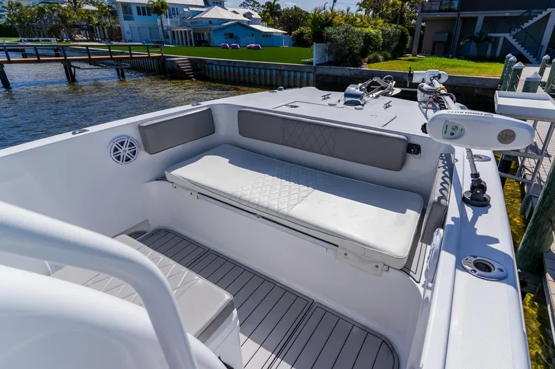 Slide: The Image of 1998 World Cat 266 SF boat interior with cushioned seating and modern equipment. - 83