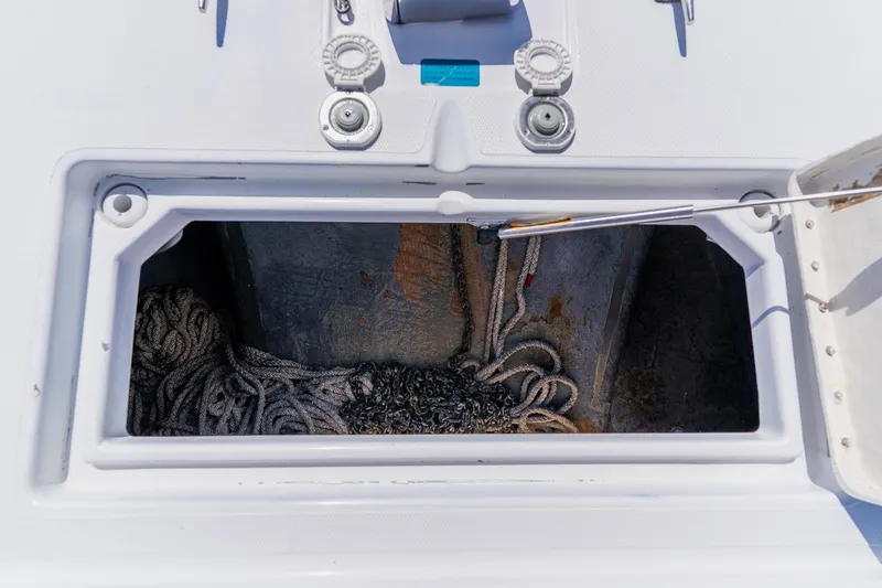 Slide: The Image of Open storage compartment on 1998 World Cat 266 SF boat with ropes inside. - 90