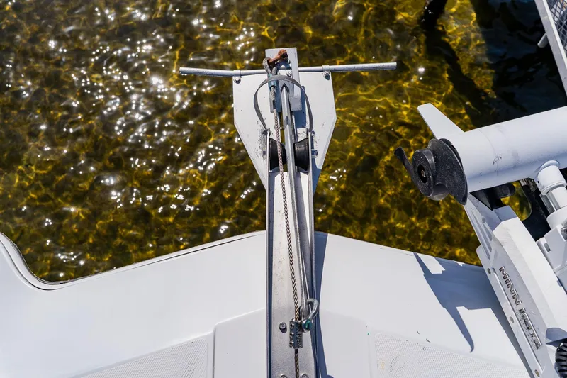 Slide: The Image of Bow of 1998 World Cat 266 SF boat with clear water below. - 92